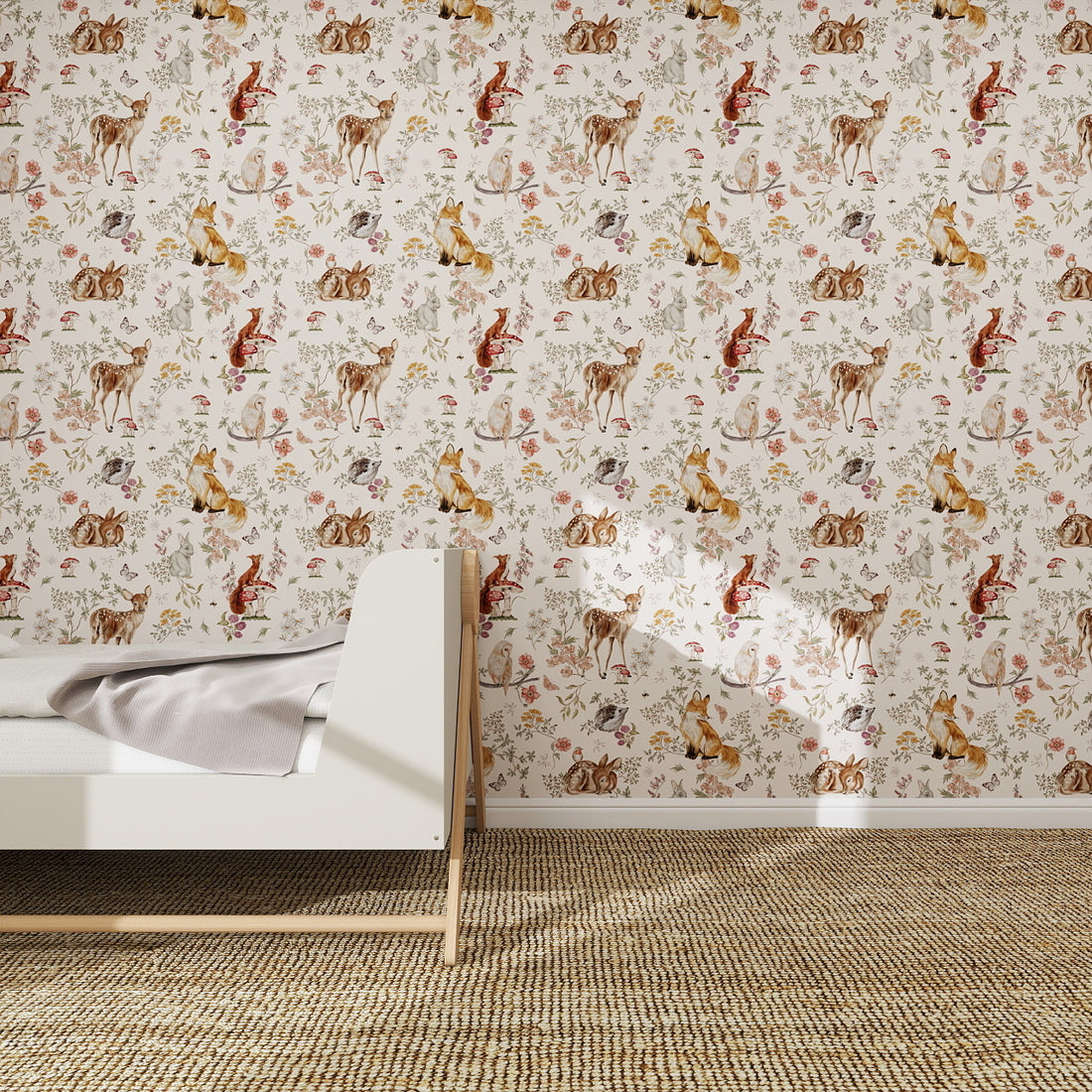 A cozy bedroom with a modern white bed, light bedding, and Whimsical Woodland Wallpaper featuring colorful animals and florals. The floor is covered with a woven beige carpet.
