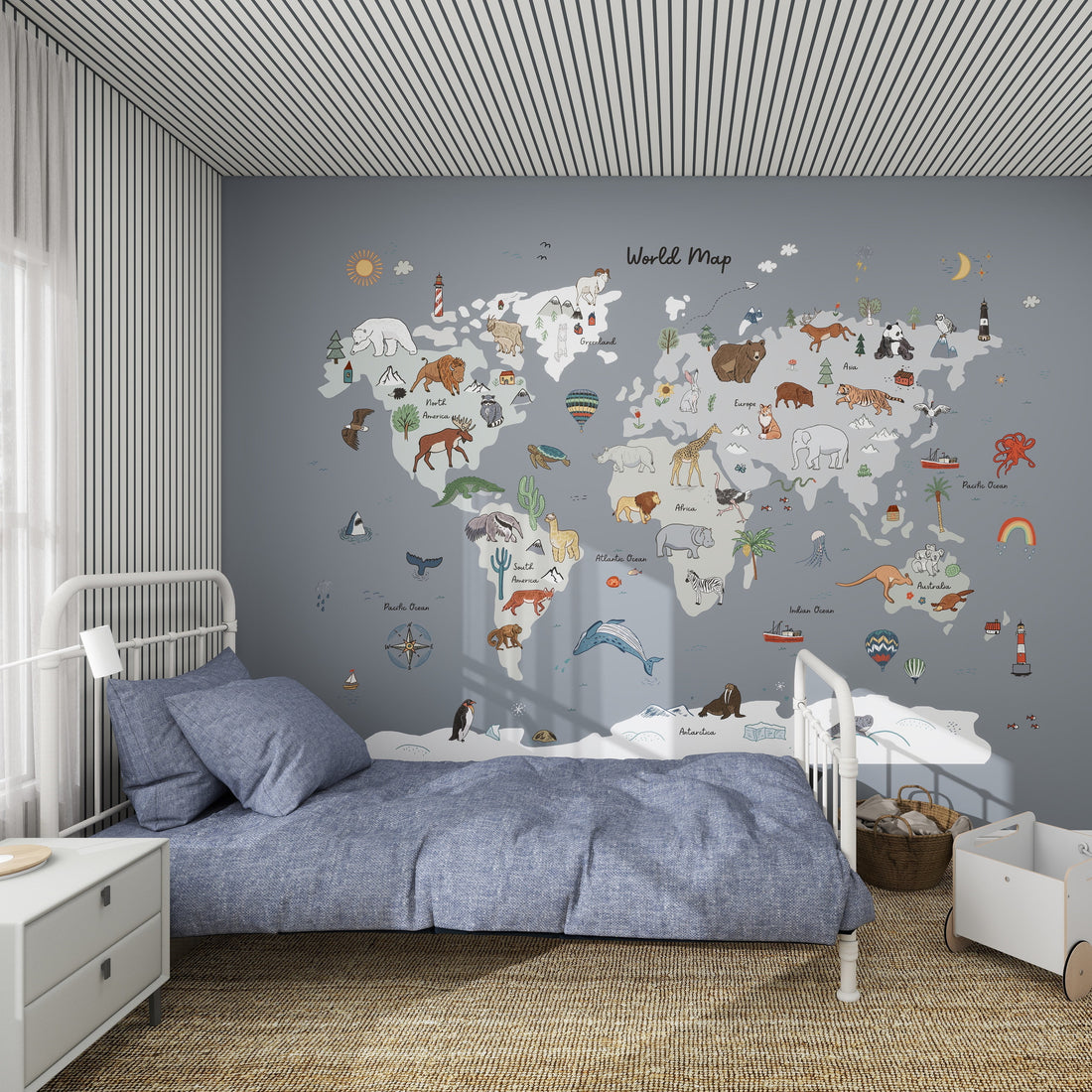 A cozy kids room with a blue bed and striped walls, featuring the World Map Mural, Blue—illustrated with animals and landmarks for each continent—to bring geography to life in a playful, educational way.