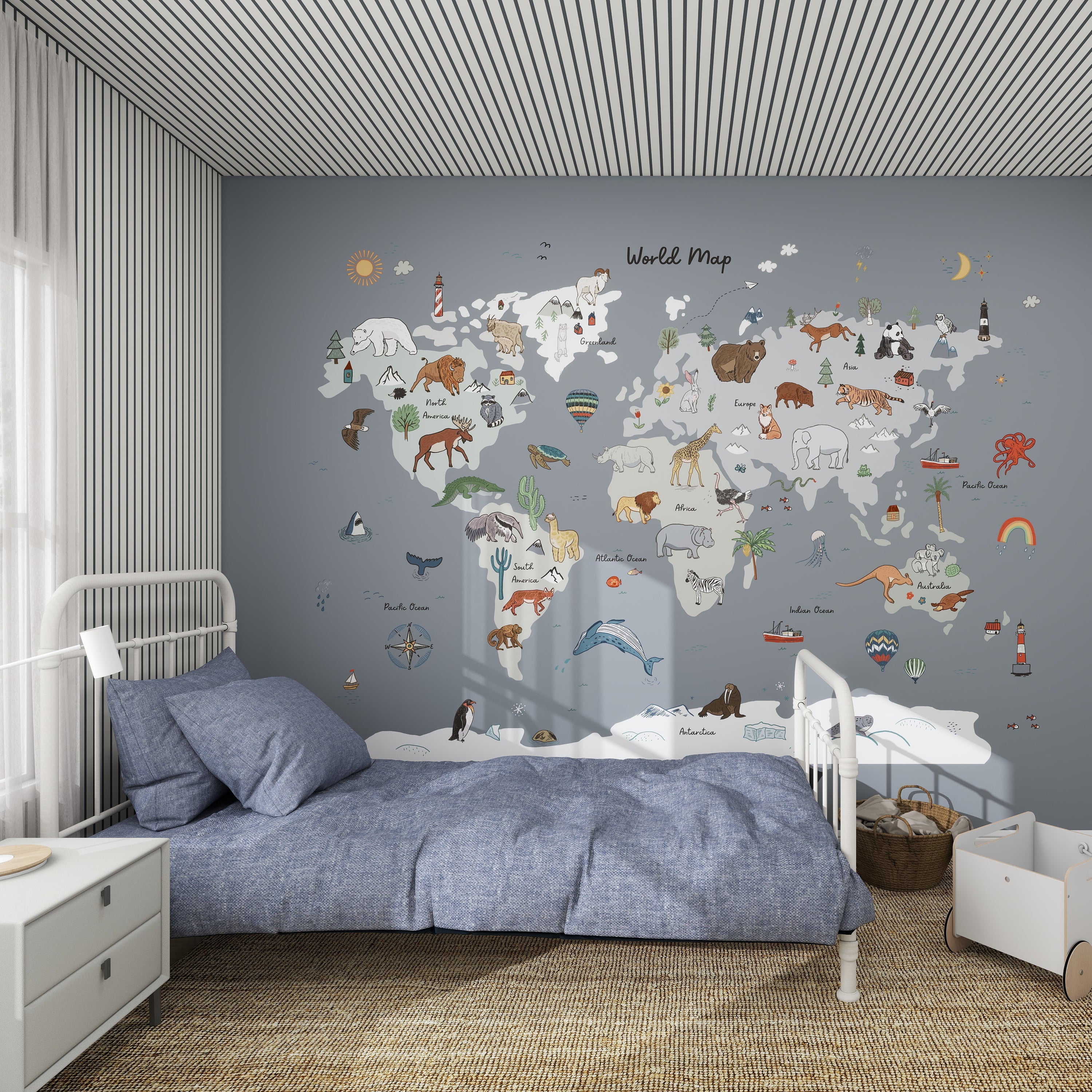 A cozy kids room with a blue bed and striped walls, featuring the World Map Mural, Blue—illustrated with animals and landmarks for each continent—to bring geography to life in a playful, educational way.